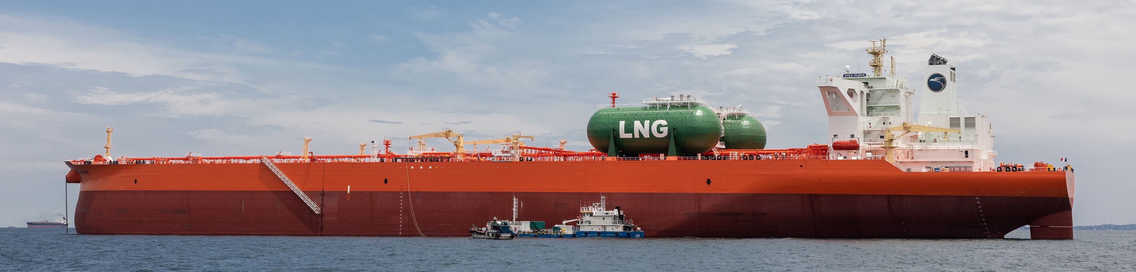 AET owned LNG Dual-Fuel Very Large Crude Carrier anchored in open water. 