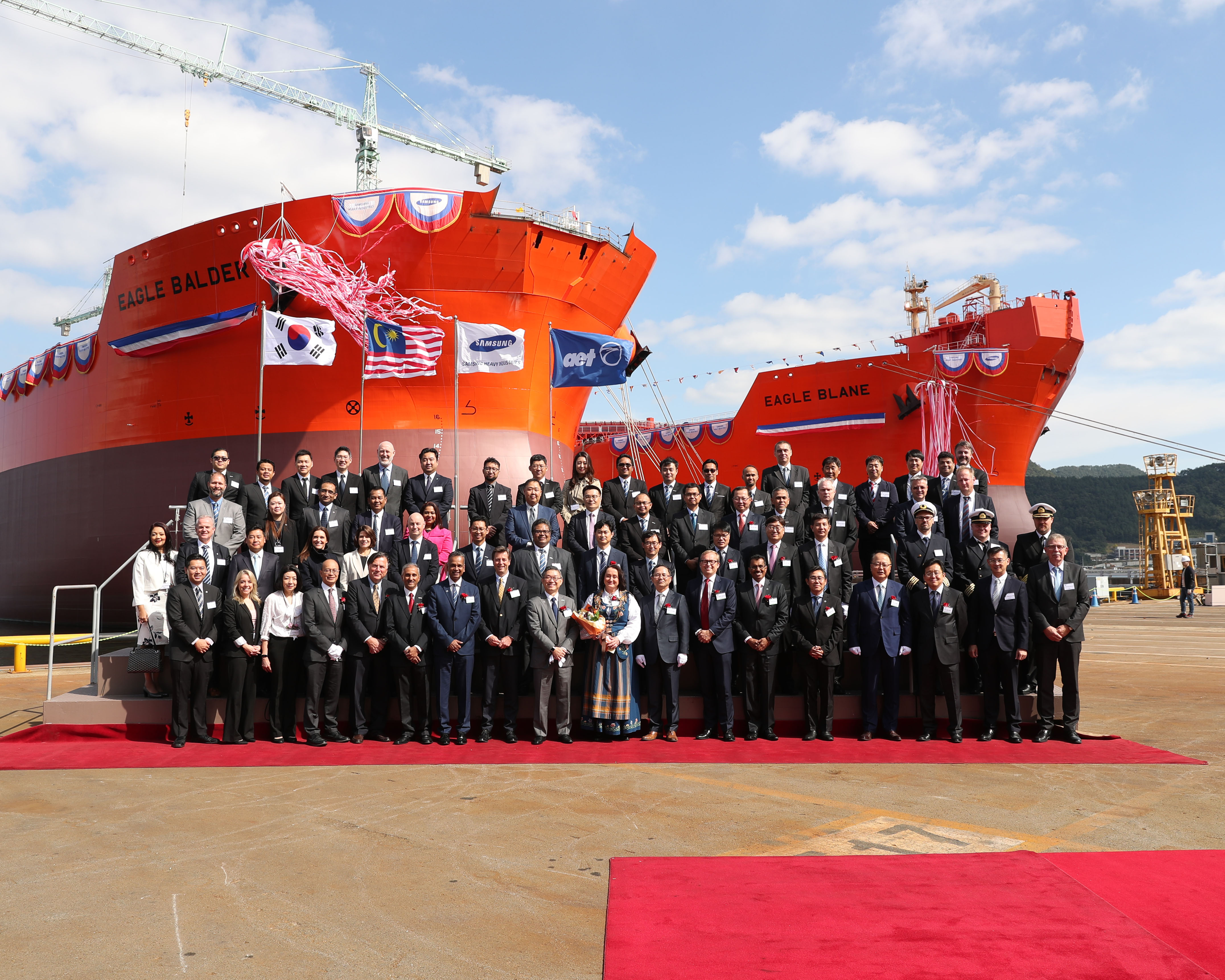 AET team standing behind Eagle Blane ship